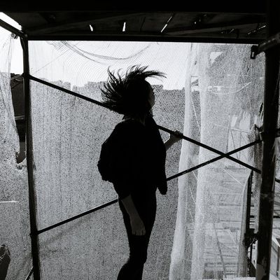 A person in a fluid motion pose, captured mid-movement.